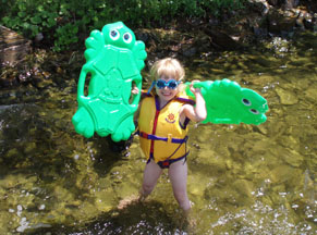 Annie in the Swim with Two Flotation Boards