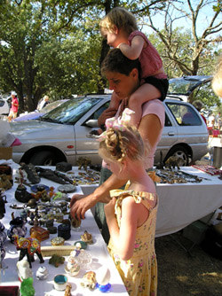 Erika and the Girls Inspecting Items at the French Flea Market