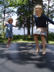 Vanessa and Annie Bouncing on the Trampoline