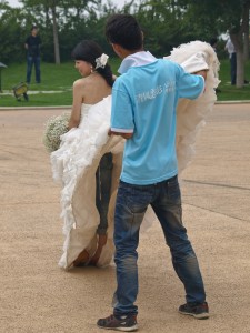 Bride's Jeans Under Her Dress (Held by Photography Assistant)