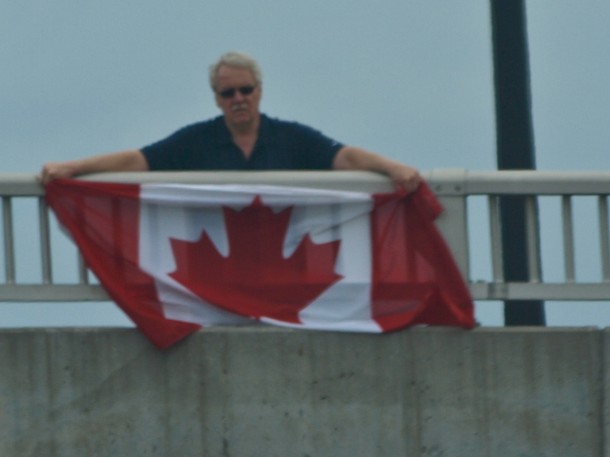 Man with Flag Over The Highway of Heroes