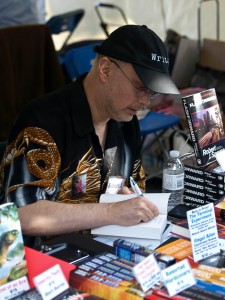 Word on the Street: Robert J. Sawyer Autographing a Book for a Fan