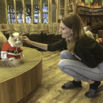 Vanessa Petting Cat in a Santa Suit