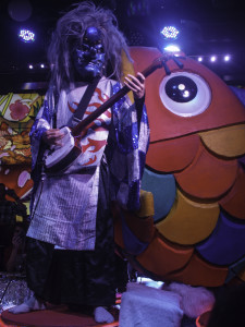 Robot Restaurant - Blue Demon-faced Character Playing Electric Shamisen