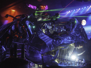 Robot Restaurant - Scowling Purple-horned Woman Riding Metal Rhino